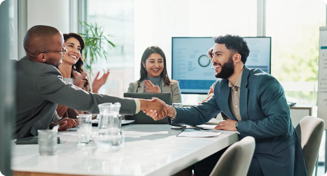 Business meeting handshake celebration